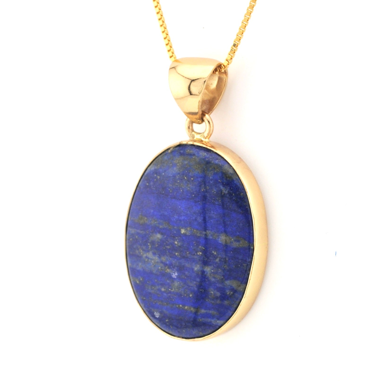 Gold pendant with a blue stone on a white background