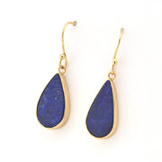Teardrop-shaped blue earrings with gold hooks on a white background