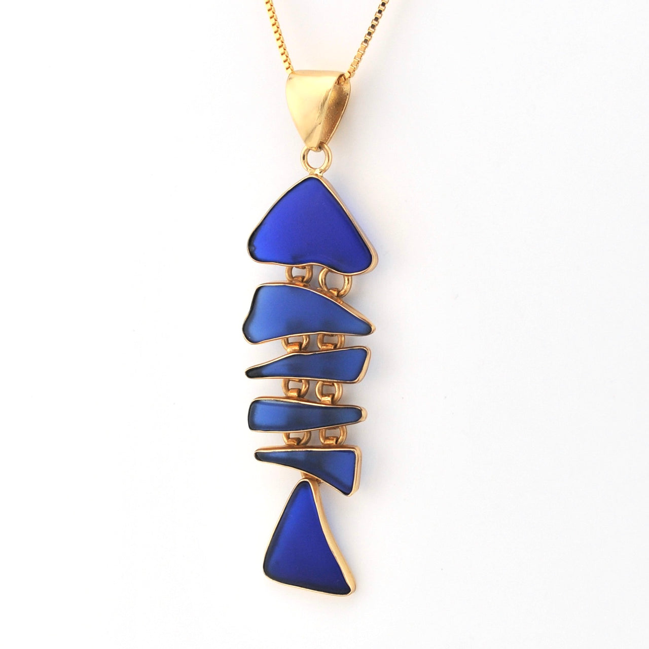 Necklace with blue triangular pendant on a white background