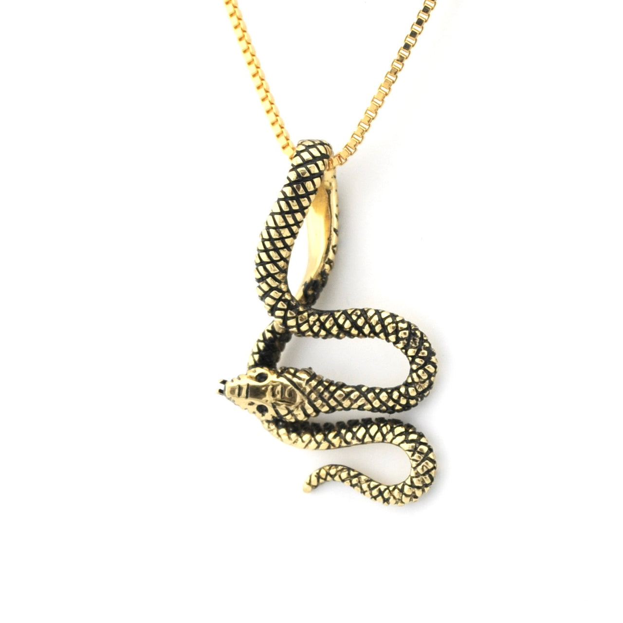 Gold snake pendant necklace on a white background