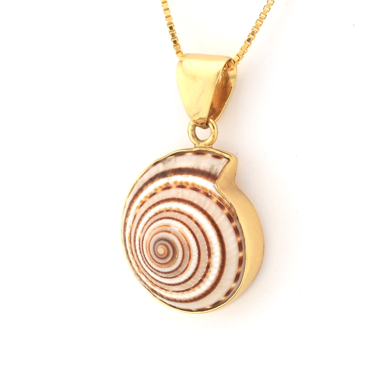 Gold pendant with a shell design on a white background
