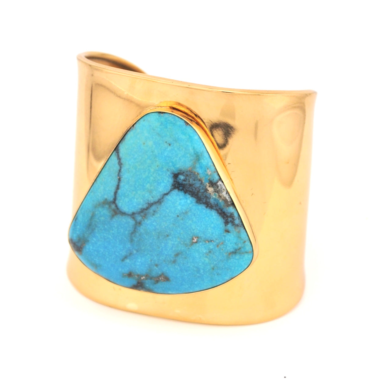 Gold cuff bracelet with a large turquoise stone on a white background