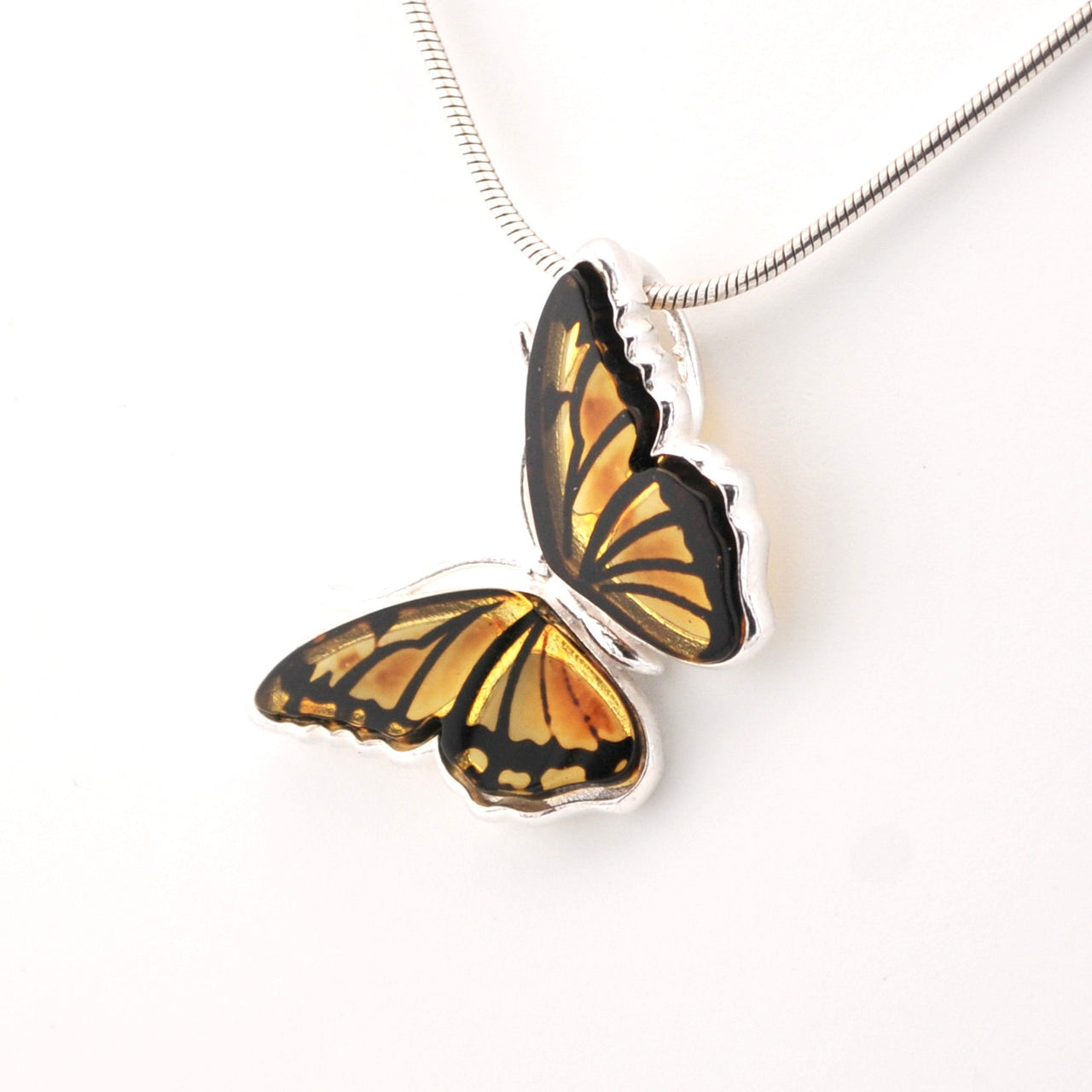 Butterfly-shaped pendant on a white background