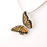 Butterfly-shaped pendant on a white background