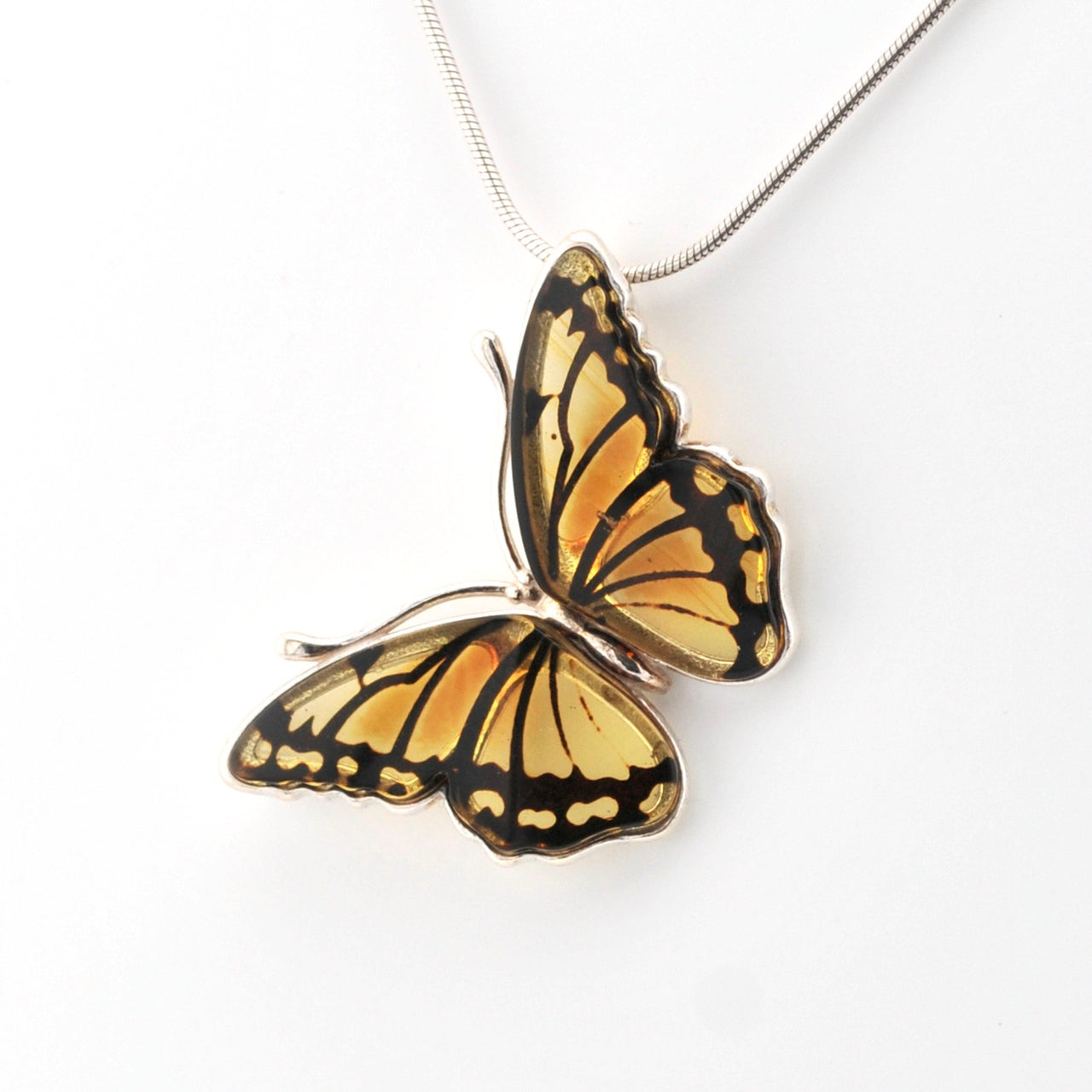 Butterfly-shaped pendant on a white background