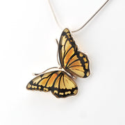 Butterfly-shaped pendant on a white background