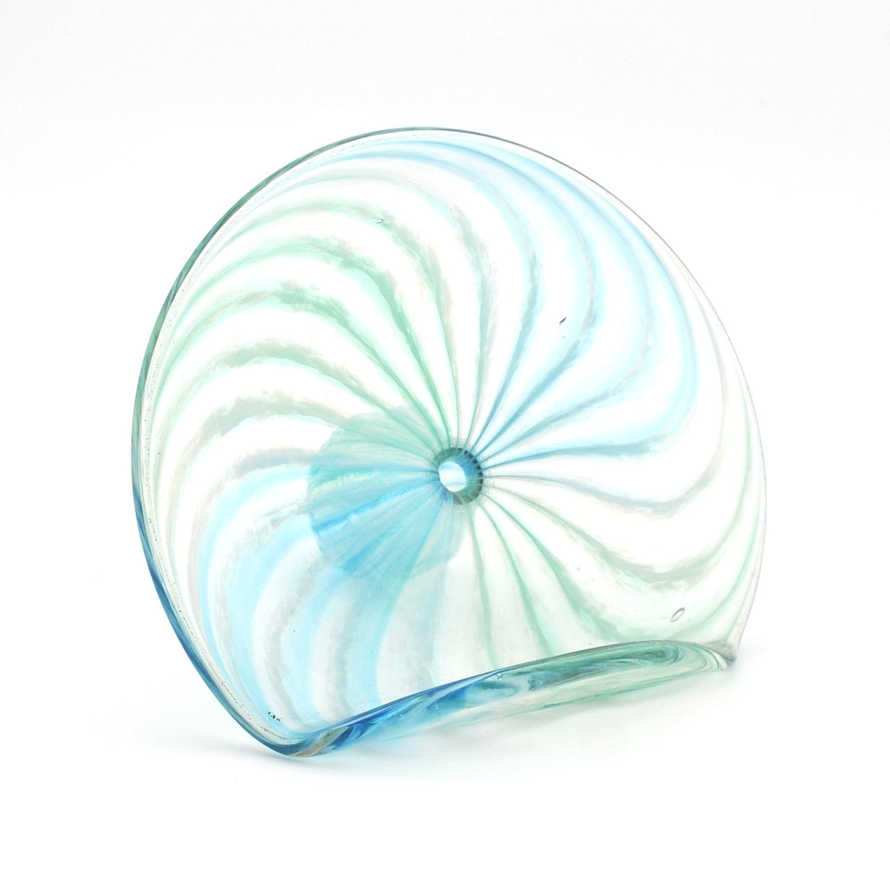 Glass sculpture with swirling pattern on a white background