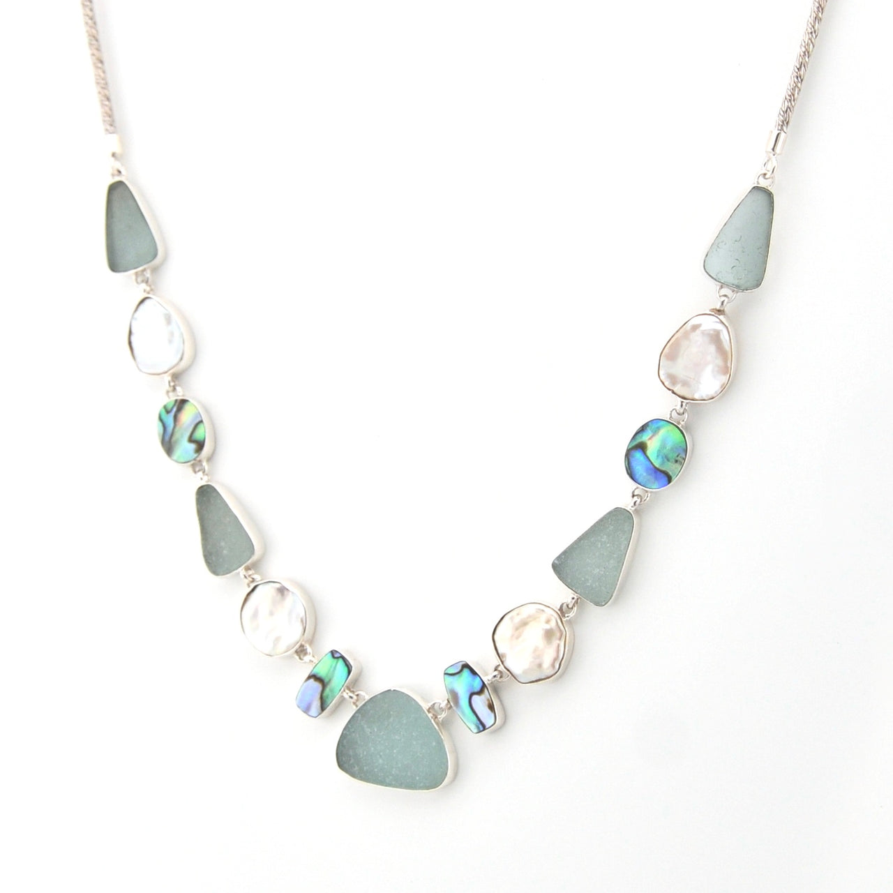 Necklace with blue and silver beads on a white background