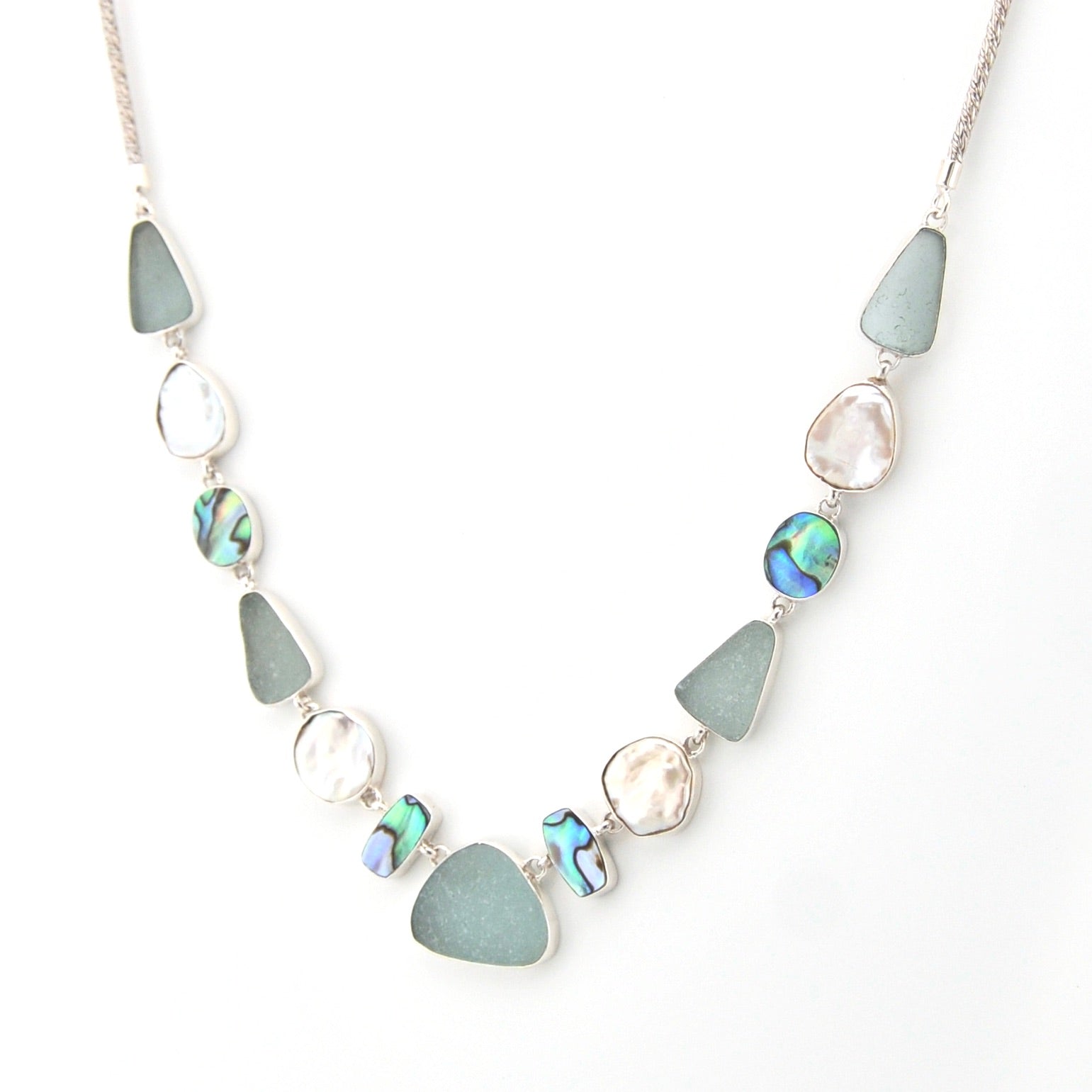 Necklace with blue and silver beads on a white background