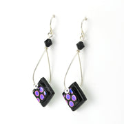 Black and purple beaded earrings on a white background