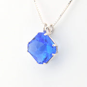 Blue gemstone necklace on a white background