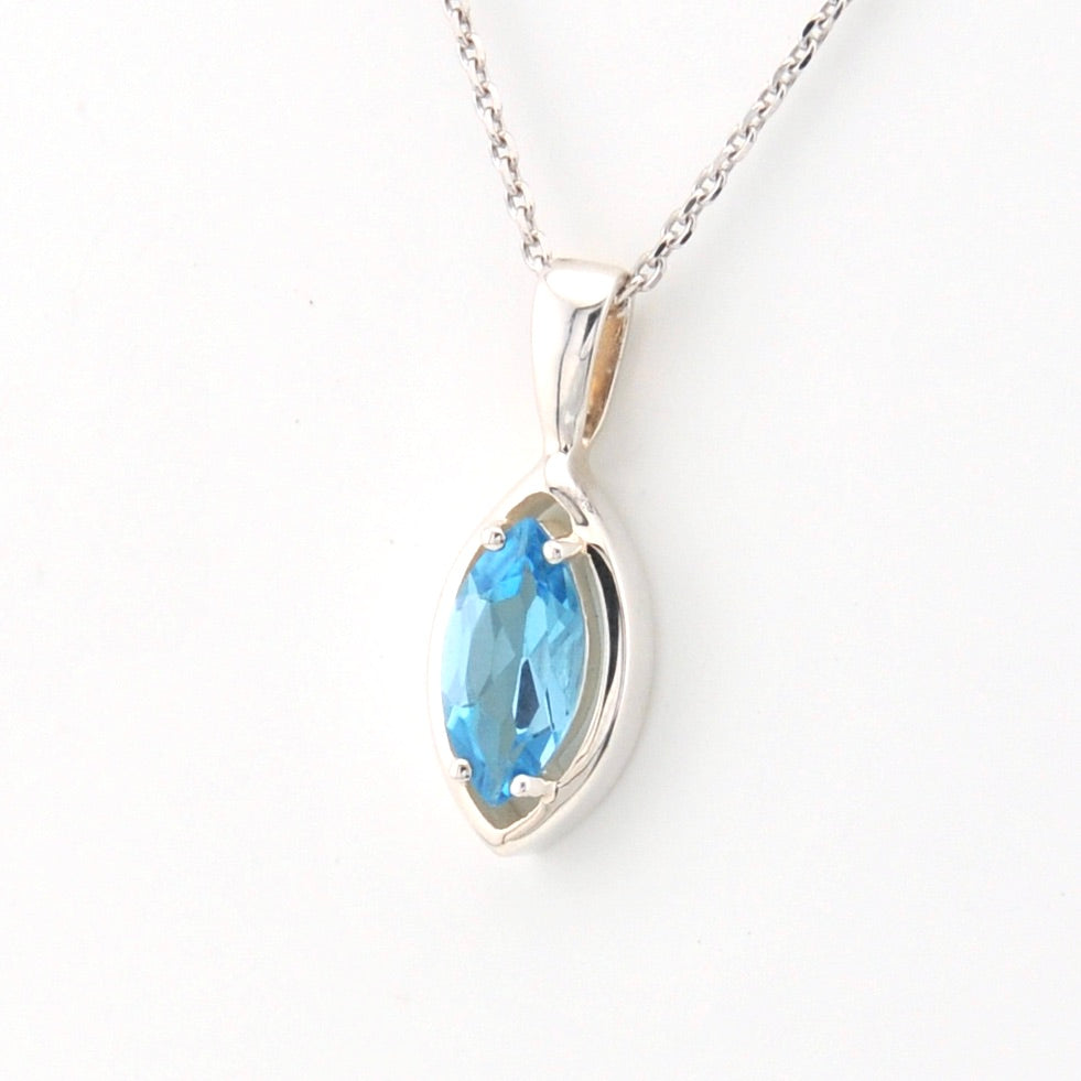 Silver necklace with a blue gemstone pendant on a white background