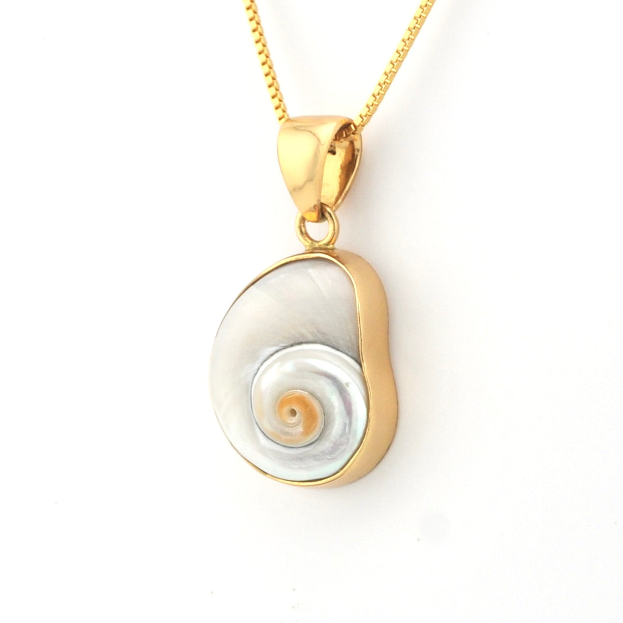 Gold and silver pendant necklace on a white background