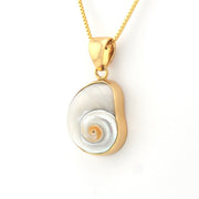 Gold and silver pendant necklace on a white background