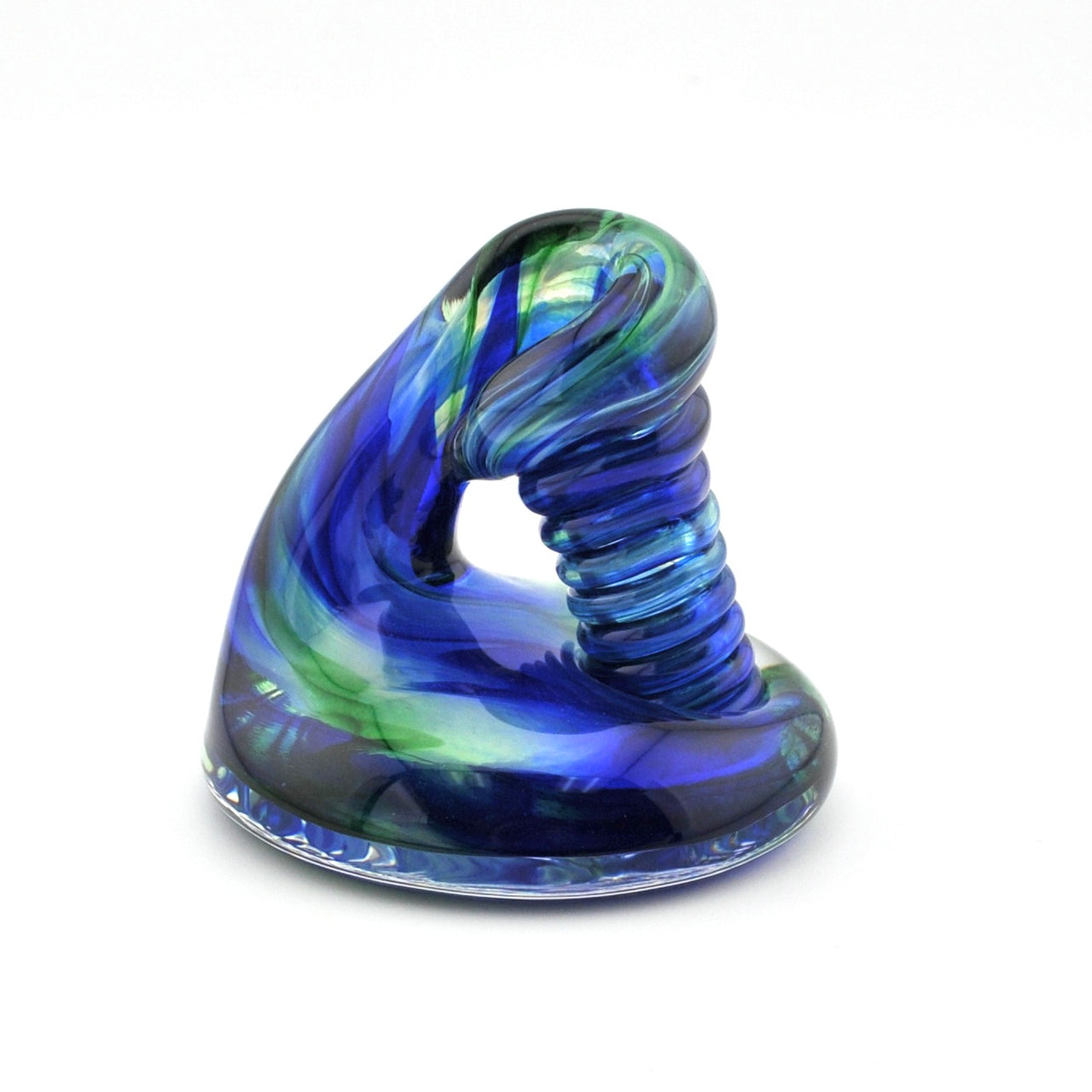 Blue and green glass sculpture on a white background