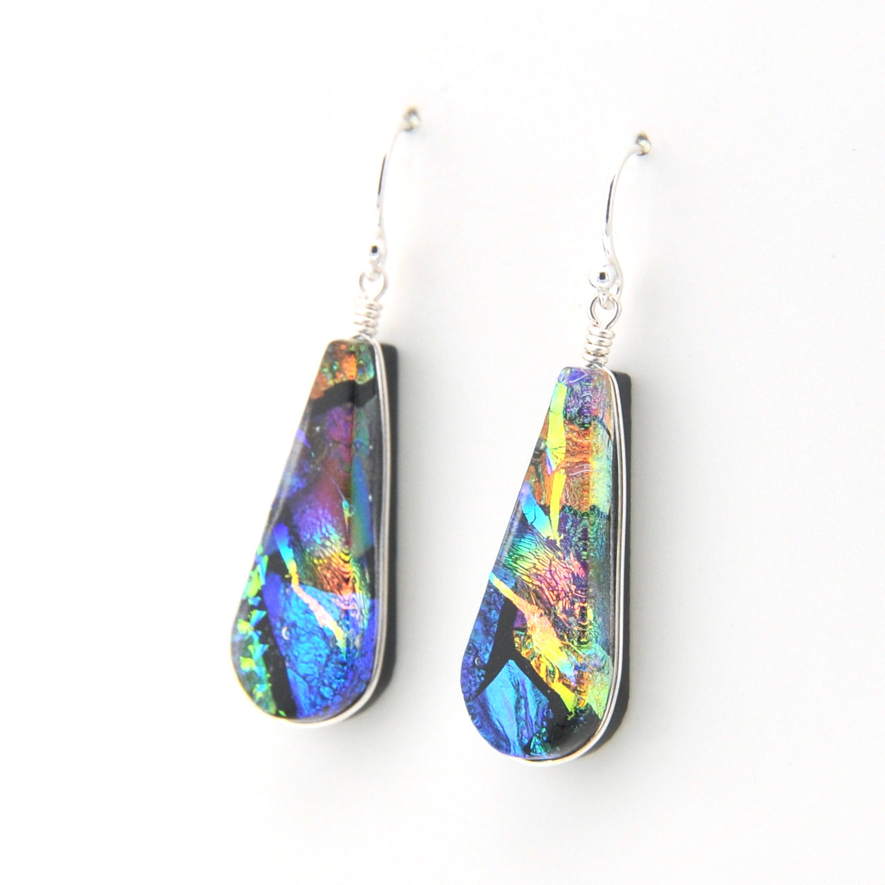 Colorful teardrop-shaped earrings on a white background