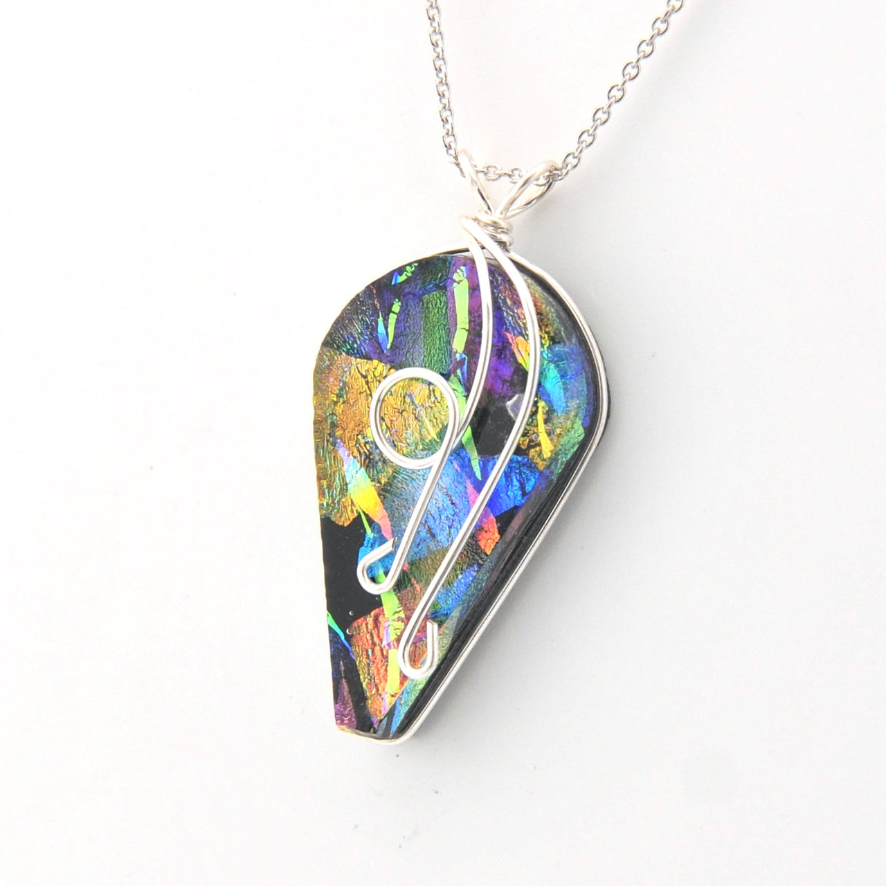 Colorful teardrop-shaped pendant on a white background