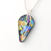Colorful teardrop-shaped pendant on a white background