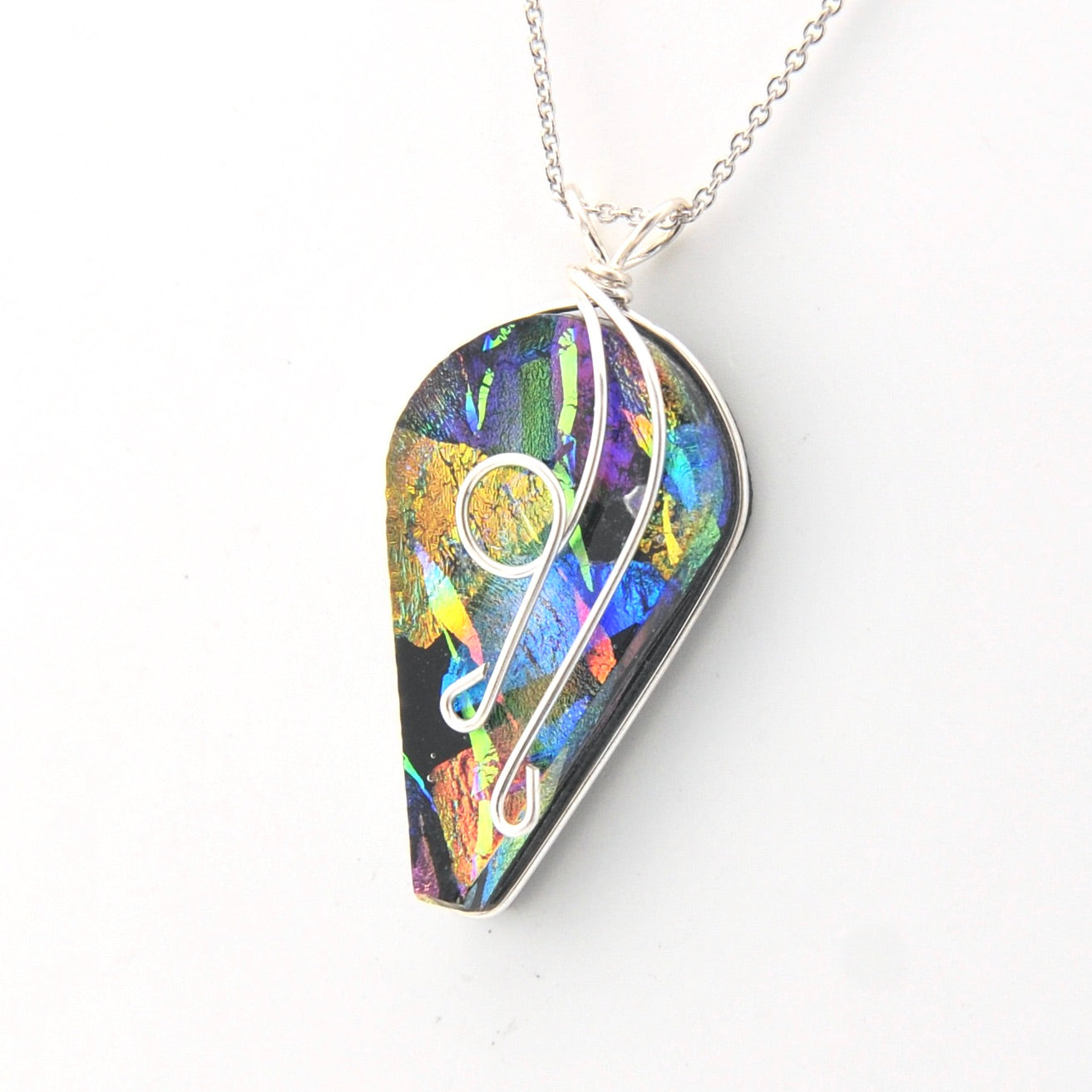 Colorful teardrop-shaped pendant on a white background