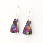 Multicolored triangular earrings on a white background