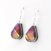 Teardrop-shaped earrings with multicolored iridescent finish on a white background