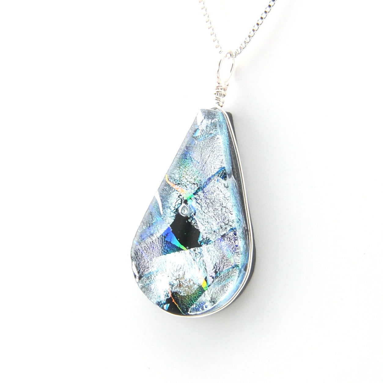 Teardrop-shaped pendant with a multicolored gemstone on a white background