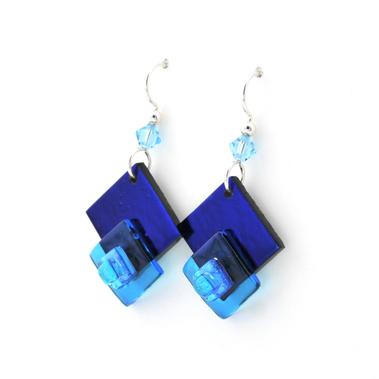 Blue square earrings with clear crystals on a white background