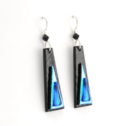 Black and blue earrings on a white background