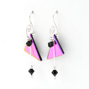 A pair of silver dangle earrings featuring triangular glass panels with a pink and purple iridescent finish, accented with small black faceted beads, shown on a plain white background.