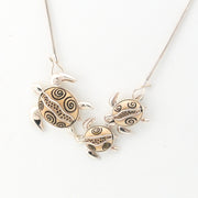 Necklace with turtle-shaped pendants on a white background