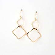 Gold hoop earrings on a white background