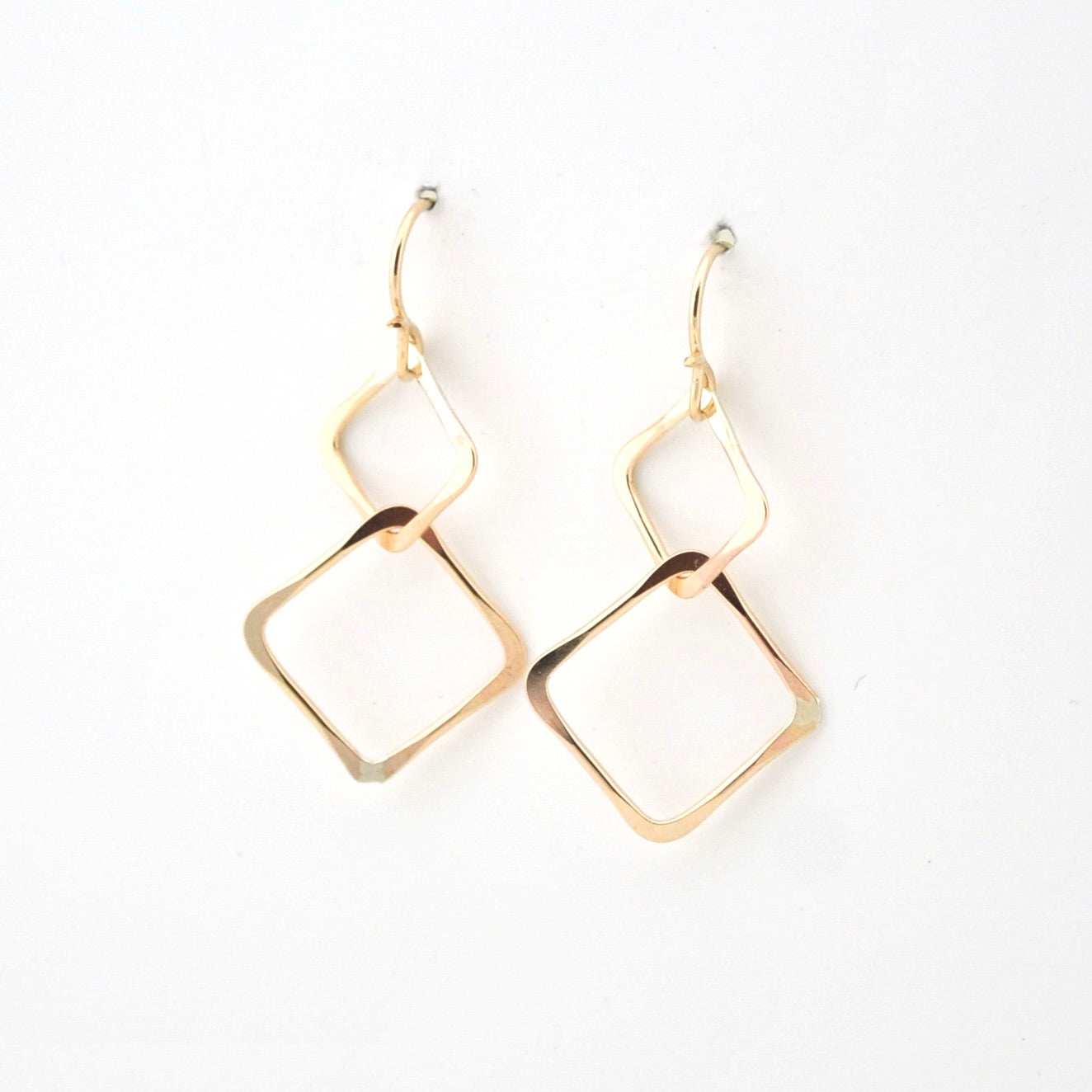 Gold hoop earrings on a white background