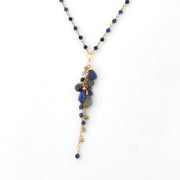 Necklace with blue and gray beads on a white background