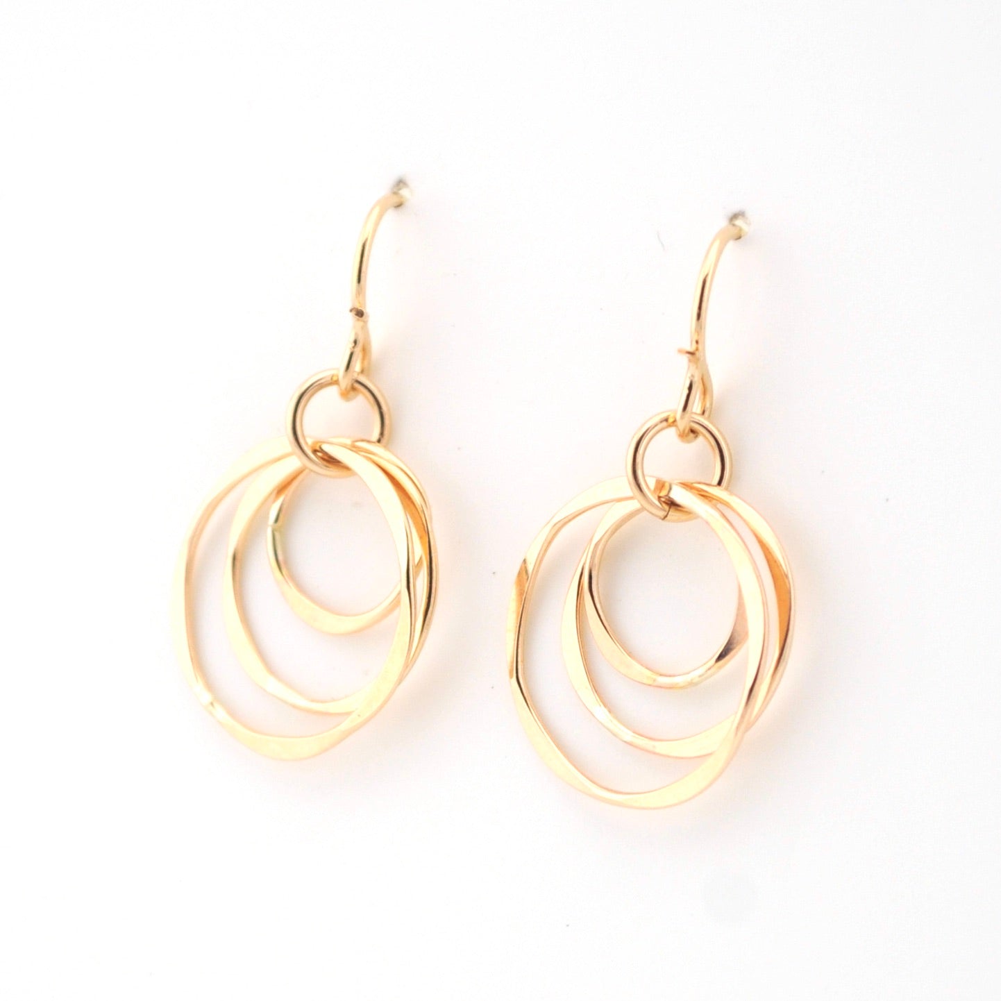 Gold hoop earrings on a white background