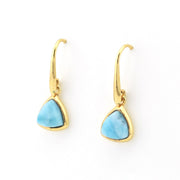 A pair of gold earrings with triangular light blue marbled stones, shown on a plain white background.