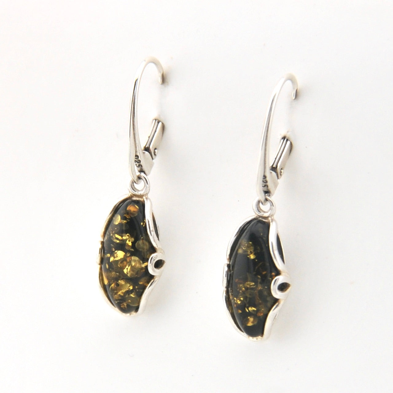 Pair of earrings with dark green and gold speckled stones on a white background