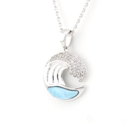 Silver wave pendant with blue accent on a white background