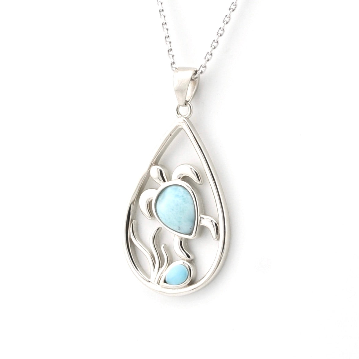 Silver teardrop pendant with a blue gemstone on a white background
