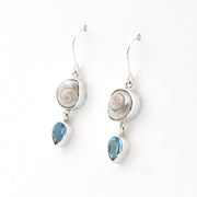 Silver earrings with shell and blue stone drops on a white background