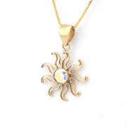Gold sun-shaped pendant necklace on a white background