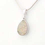 Teardrop-shaped pendant on a chain against a white background