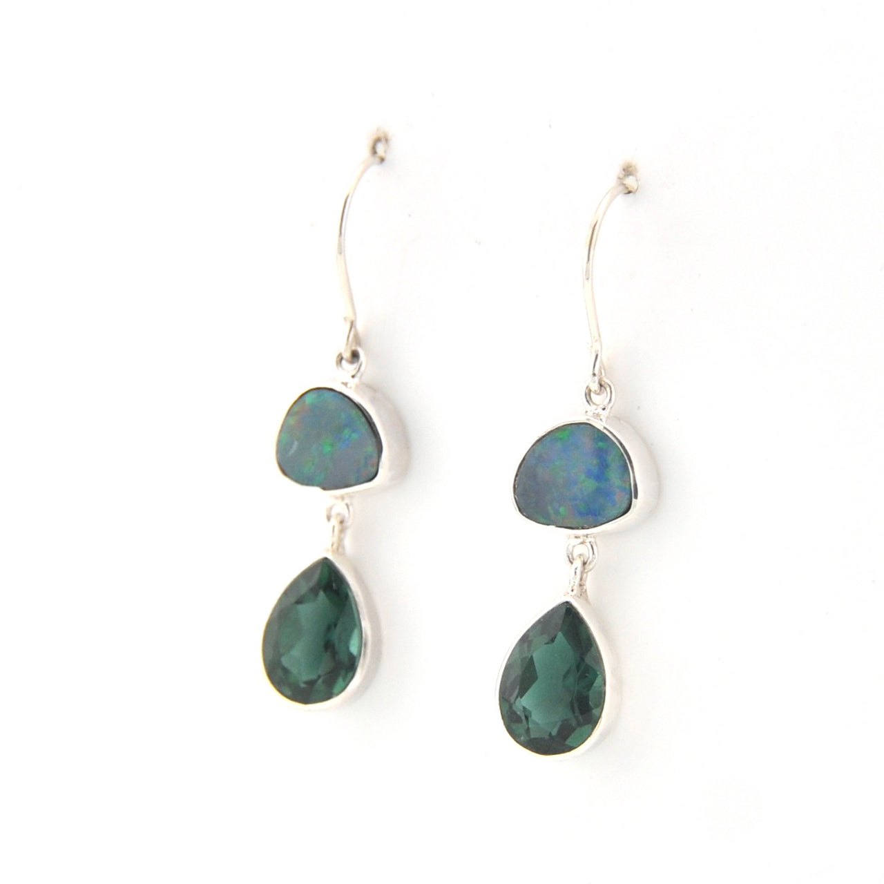 Pair of earrings with green teardrop-shaped stones on a white background