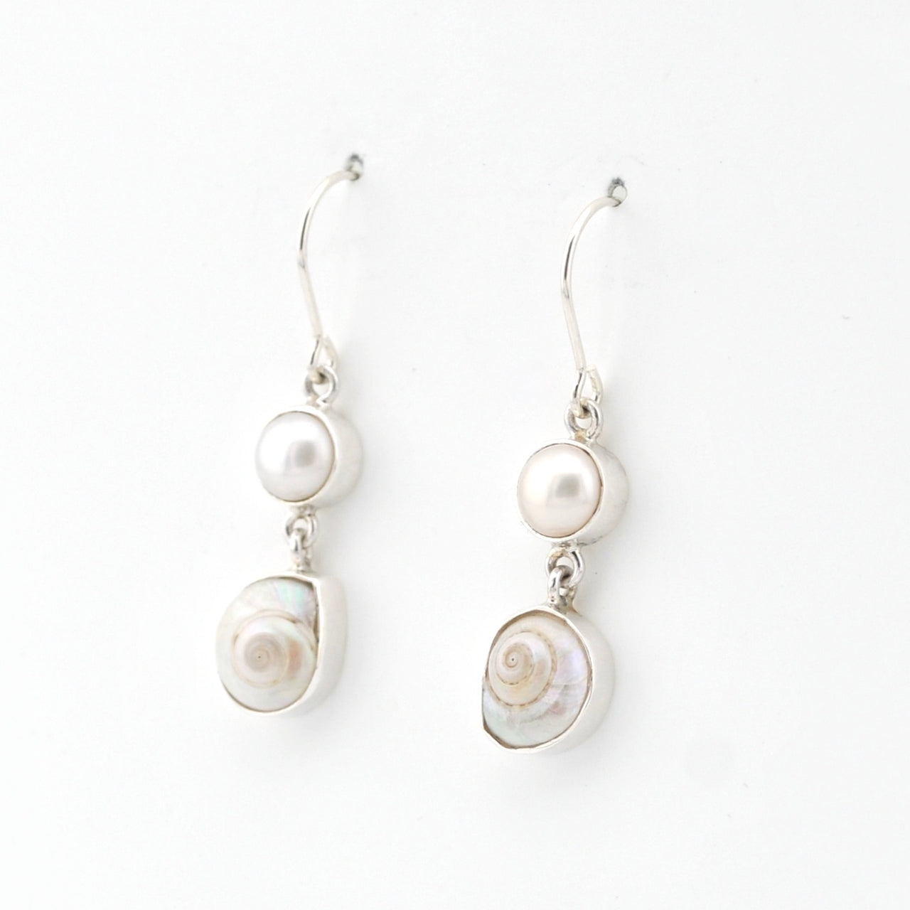 Pair of pearl earrings on a white background