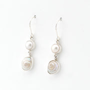 Pair of pearl earrings on a white background