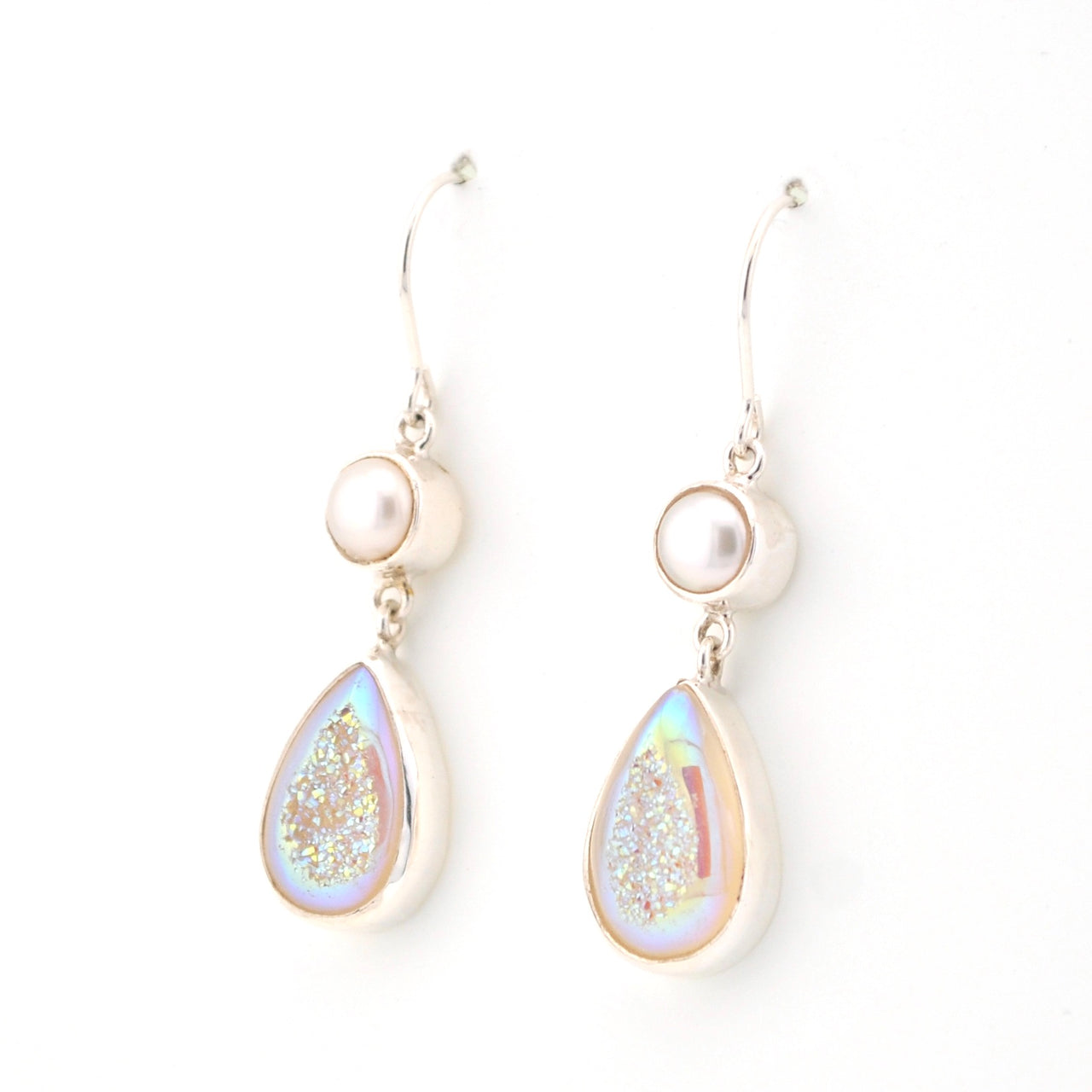 Teardrop-shaped earrings with pearl-like beads on a white background
