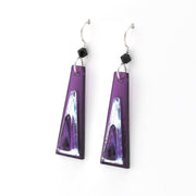 Purple geometric earrings with black accents on a white background