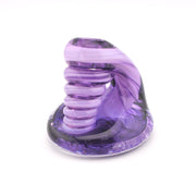Purple glass sculpture on a white background