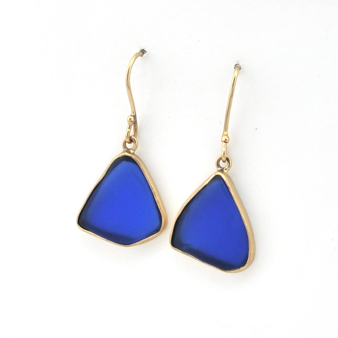 Blue teardrop earrings with gold hooks on a white background