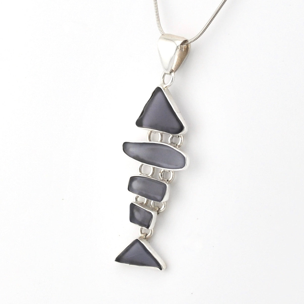 Necklace with a blue violet pendant on a white background