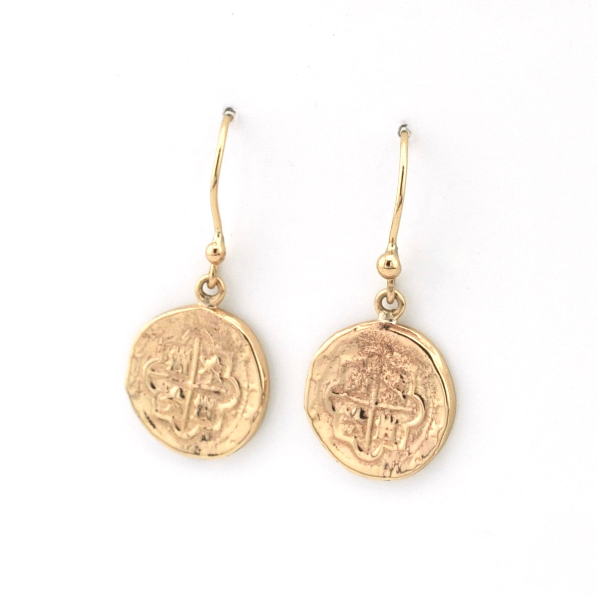 Gold coin-shaped earrings on a white background